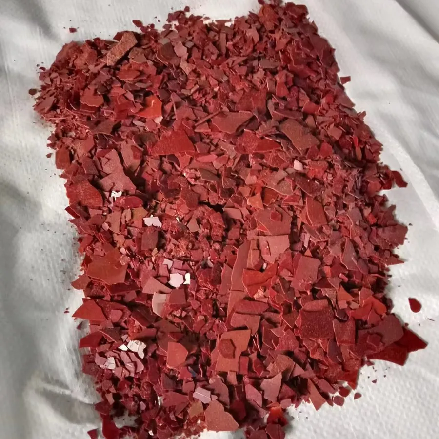Close-up of 60% sodium sulphide red flakes