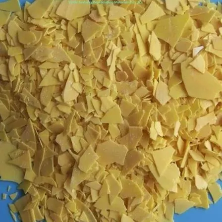Yellow sodium sulphide flakes sample in glass dish