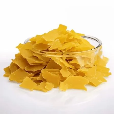 Close-up of yellow sodium sulphide flakes 60%